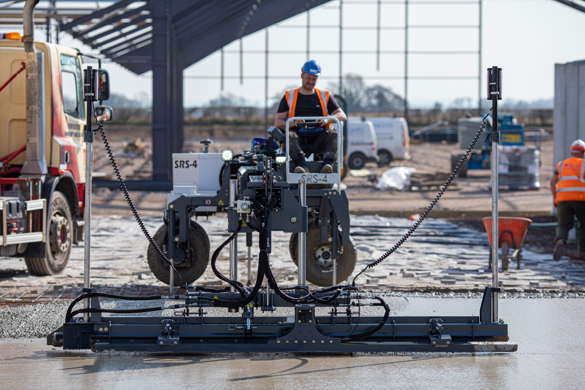 An experienced operator levelling a new concrete floor.